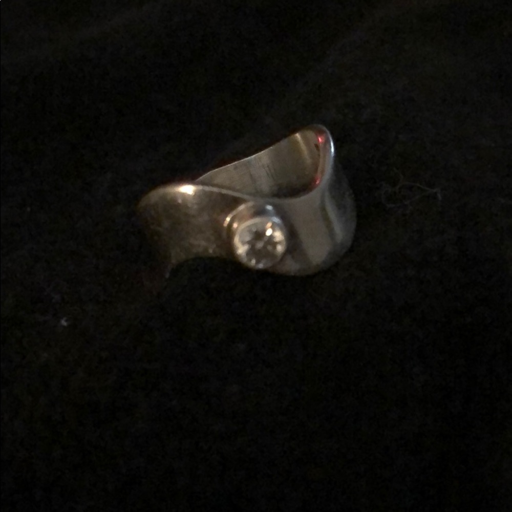 Sterling silver wave band with stone.